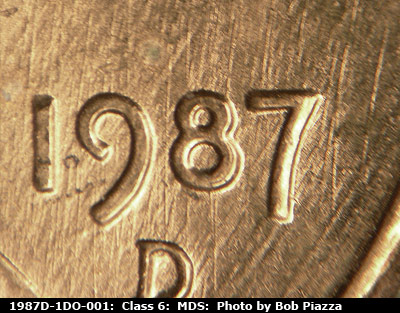 Die-stage B marker on 1987D•1DO•001 (1987 Doubled Die Obverse).