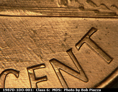 Die-stage B marker on 1987D•1DO•001 (1987 Doubled Die Obverse).