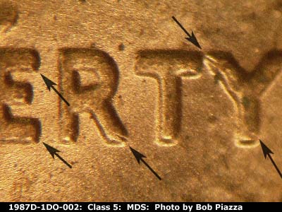 Die-stage B marker on 1987D•1DO•002 (1987 Doubled Die Obverse).