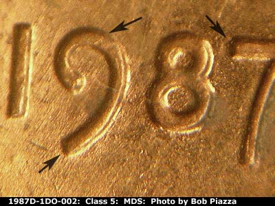 Die-stage B marker on 1987D•1DO•002 (1987 Doubled Die Obverse).