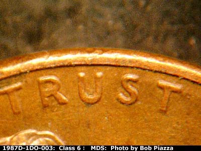 Die-stage B marker on 1987D•1DO•003 (1987 Doubled Die Obverse).