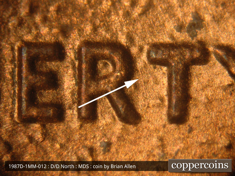 Die-stage B marker on 1987D•1MM•012 (1987 Repunched Mint Mark).