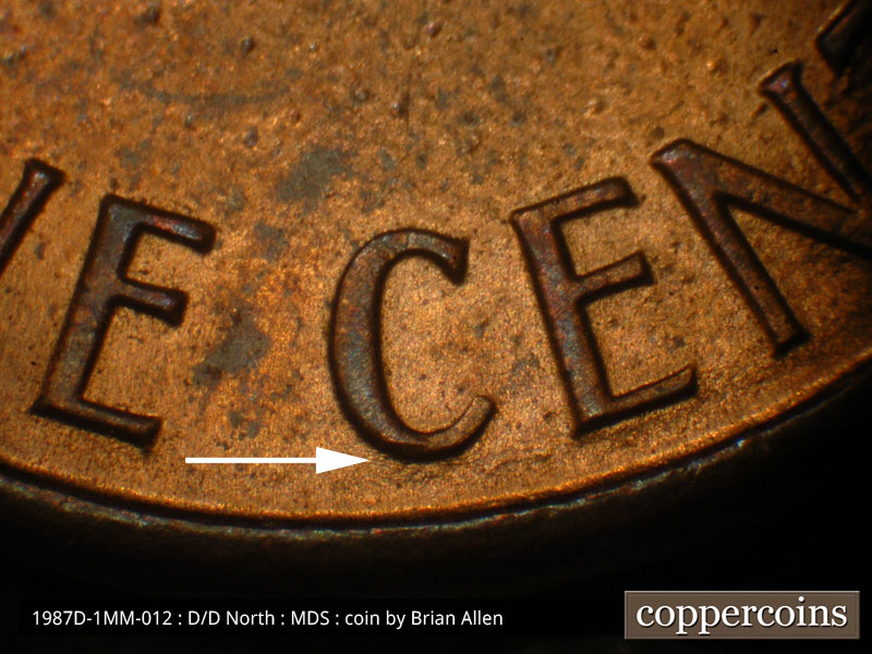 Die-stage B marker on 1987D•1MM•012 (1987 Repunched Mint Mark).