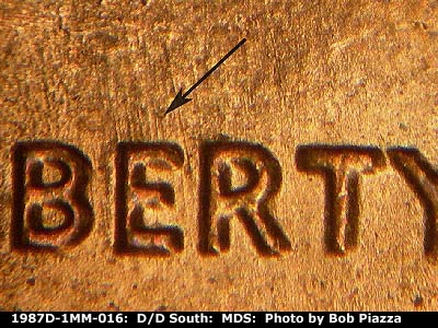Die-stage B marker on 1987D•1MM•016 (1987 Repunched Mint Mark).