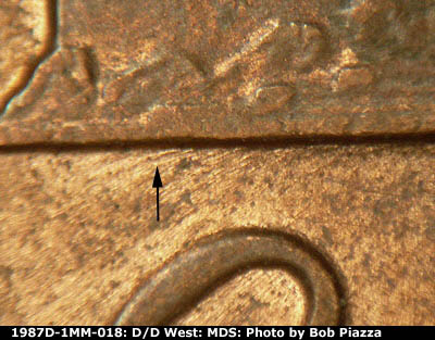 Die-stage B marker on 1987D•1MM•018 (1987 Repunched Mint Mark).