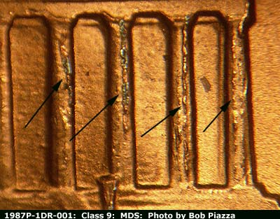 Die-stage B marker on 1987P•1DR•001 (1987 Doubled Die Reverse).