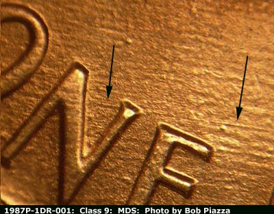Die-stage B marker on 1987P•1DR•001 (1987 Doubled Die Reverse).