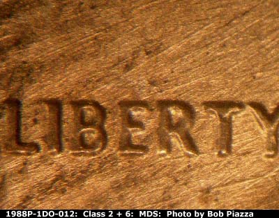 Die-stage B marker on 1988P•1DO•012 (1988 Doubled Die Obverse).