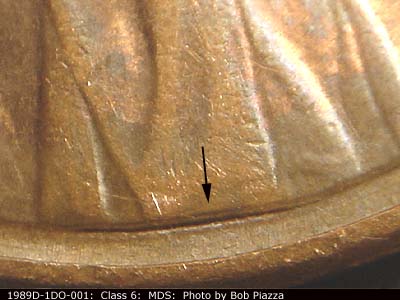 Die-stage B marker on 1989D•1DO•001 (1989 Doubled Die Obverse).