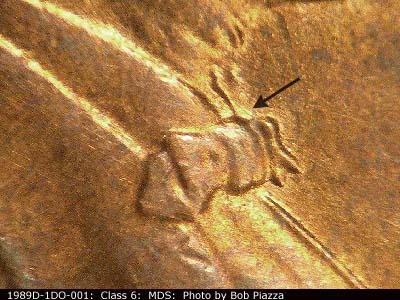 Die-stage B marker on 1989D•1DO•001 (1989 Doubled Die Obverse).
