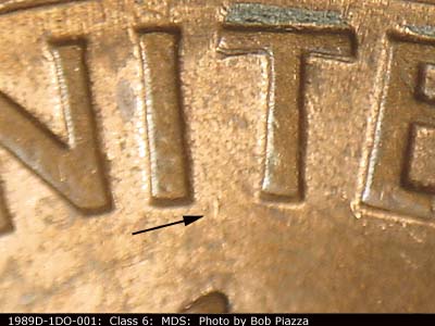 Die-stage B marker on 1989D•1DO•001 (1989 Doubled Die Obverse).