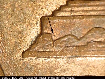 Die-stage B marker on 1989D•1DO•001 (1989 Doubled Die Obverse).
