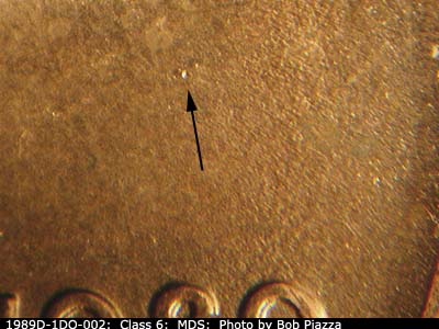Die-stage B marker on 1989D•1DO•002 (1989 Doubled Die Obverse).