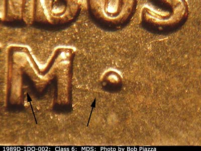 Die-stage B marker on 1989D•1DO•002 (1989 Doubled Die Obverse).