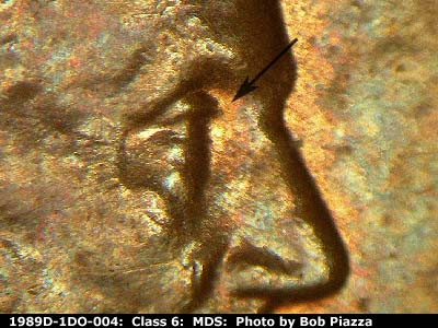 Die-stage B marker on 1989D•1DO•004 (1989 Doubled Die Obverse).