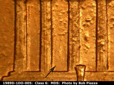 Die-stage B marker on 1989D•1DO•005 (1989 Doubled Die Obverse).