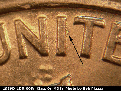 Die-stage B marker on 1989D•1DR•005 (1989 Doubled Die Reverse).