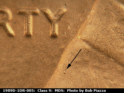 Die-stage B marker on 1989D•1DR•005 (1989 Doubled Die Reverse).