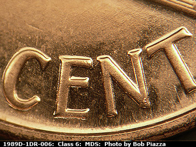 Die-stage B marker on 1989D•1DR•006 (1989 Doubled Die Reverse).
