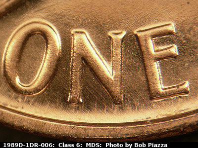 Die-stage B marker on 1989D•1DR•006 (1989 Doubled Die Reverse).