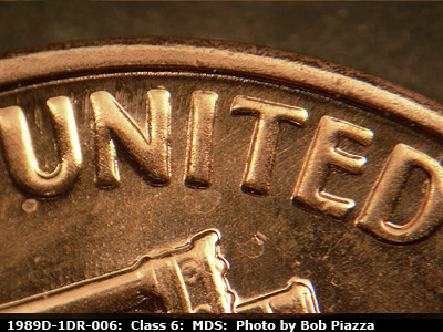 Die-stage B marker on 1989D•1DR•006 (1989 Doubled Die Reverse).