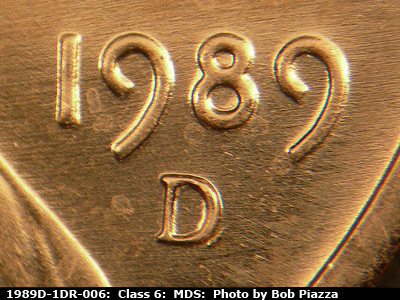 Die-stage B marker on 1989D•1DR•006 (1989 Doubled Die Reverse).