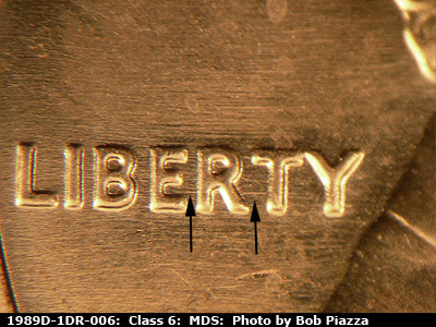 Die-stage B marker on 1989D•1DR•006 (1989 Doubled Die Reverse).