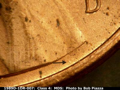 Die-stage B marker on 1989D•1DR•007 (1989 Doubled Die Reverse).