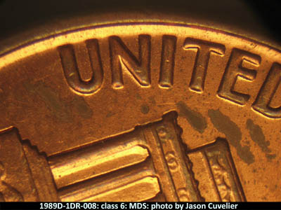 Die-stage B marker on 1989D•1DR•008 (1989 Doubled Die Reverse).