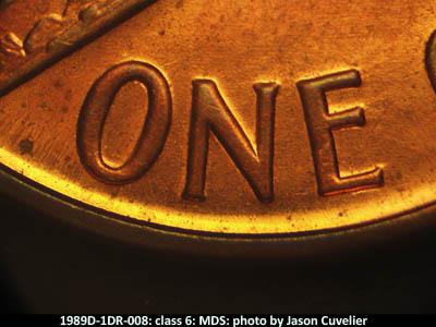 Die-stage B marker on 1989D•1DR•008 (1989 Doubled Die Reverse).