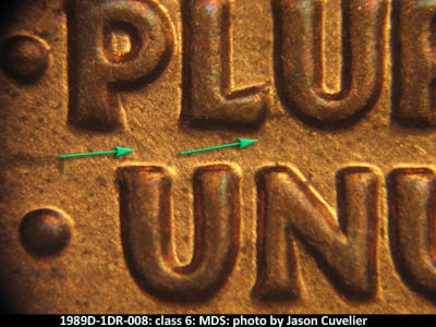 Die-stage B marker on 1989D•1DR•008 (1989 Doubled Die Reverse).