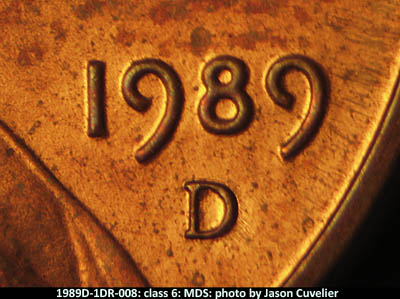 Die-stage B marker on 1989D•1DR•008 (1989 Doubled Die Reverse).