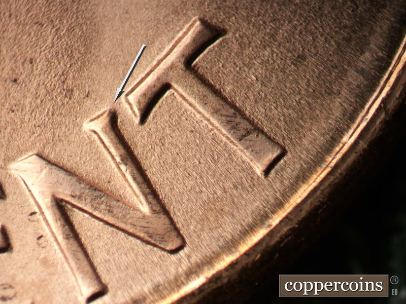 Die-stage B marker on 1989D•1DR•009 (1989 Doubled Die Reverse).