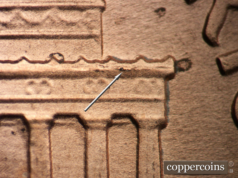 Die-stage B marker on 1989D•1DR•009 (1989 Doubled Die Reverse).