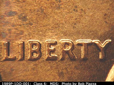 Die-stage B marker on 1989P•1DO•001 (1989 Doubled Die Obverse).