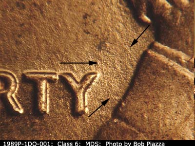 Die-stage B marker on 1989P•1DO•001 (1989 Doubled Die Obverse).