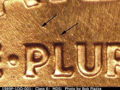 Die-stage B marker on 1989P•1DO•001 (1989 Doubled Die Obverse).