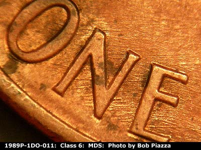 Die-stage B marker on 1989P•1DO•011 (1989 Doubled Die Obverse).
