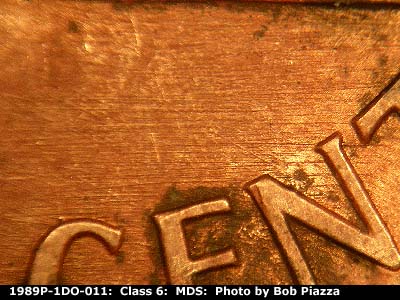 Die-stage B marker on 1989P•1DO•011 (1989 Doubled Die Obverse).