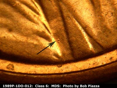 Die-stage B marker on 1989P•1DO•012 (1989 Doubled Die Obverse).