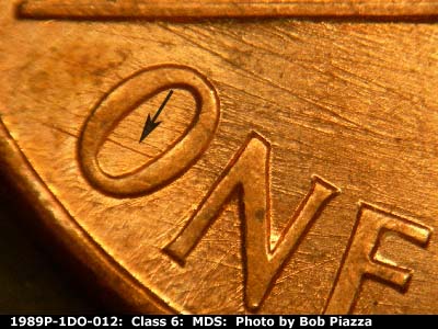 Die-stage B marker on 1989P•1DO•012 (1989 Doubled Die Obverse).