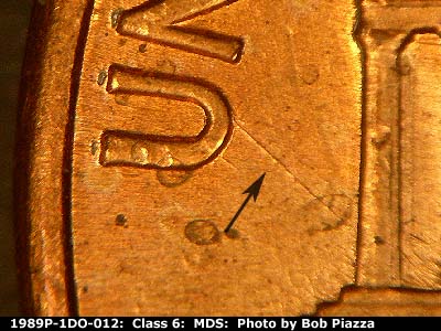 Die-stage B marker on 1989P•1DO•012 (1989 Doubled Die Obverse).