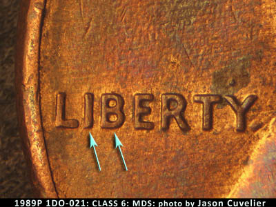 Die-stage B marker on 1989P•1DO•021 (1989 Doubled Die Obverse).