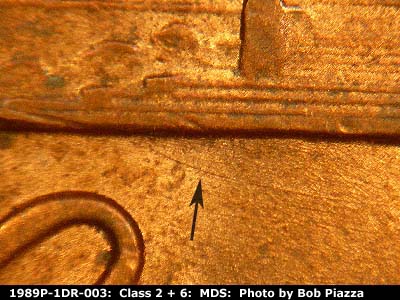 Die-stage B marker on 1989P•1DR•003 (1989 Doubled Die Reverse).