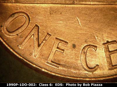 Die-stage A marker on 1990P•1DO•002 (1990 Doubled Die Obverse).