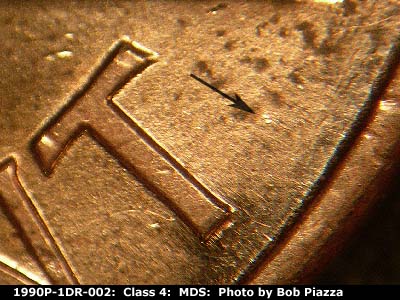 Die-stage B marker on 1990P•1DR•002 (1990 Doubled Die Reverse).