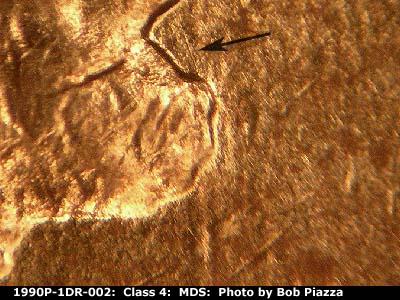 Die-stage B marker on 1990P•1DR•002 (1990 Doubled Die Reverse).