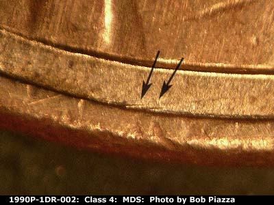 Die-stage B marker on 1990P•1DR•002 (1990 Doubled Die Reverse).