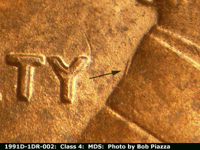 Die-stage B marker on 1991D•1DR•002 (1991 Doubled Die Reverse).