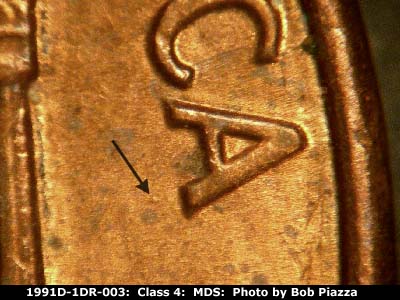 Die-stage B marker on 1991D•1DR•003 (1991 Doubled Die Reverse).